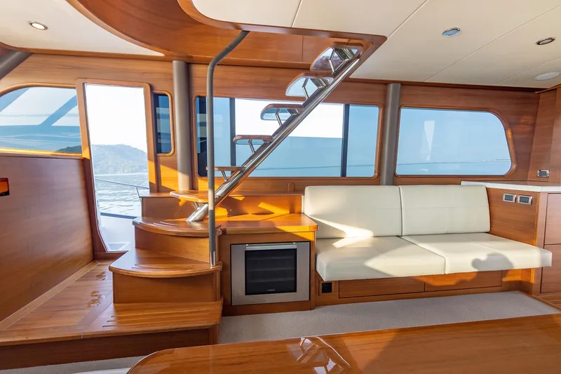Slide: The Image of Luxurious interior of 2026 Grand Banks GB 60 yacht with wooden finish and modern seating. - 3
