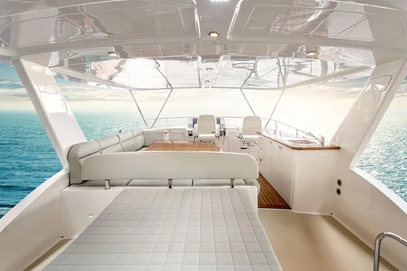 Slide: The Image of Luxurious 2026 Grand Banks GB 60 yacht interior with ocean view and elegant seating. - 5