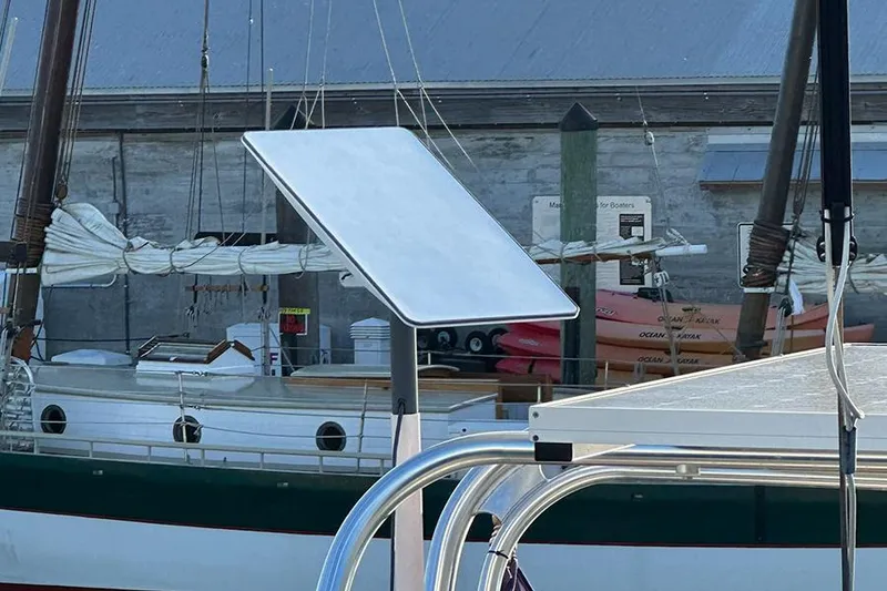 Slide: The Image of Jeanneau Sun Odyssey 490 sailboat, 2019 model, docked with visible solar panel installation. - 19