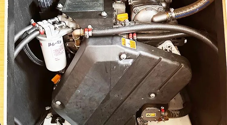 Slide: The Image of Engine compartment of a 2019 Jeanneau Sun Odyssey 490 sailboat, showcasing mechanical components. - 20