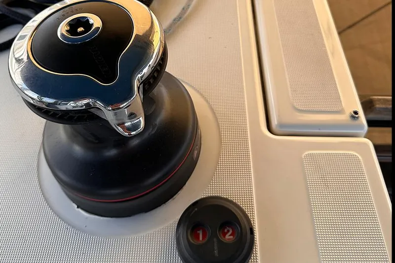 Slide: The Image of Winch and controls on 2019 Jeanneau Sun Odyssey 490 sailboat deck. - 28