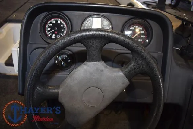 Slide: The Image of Dashboard of 1997 ProCraft 180 boat with steering wheel and gauges. - 17
