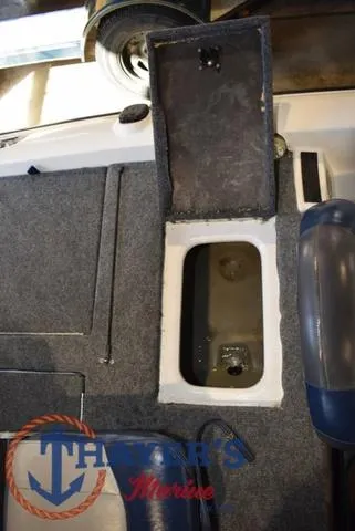 Slide: The Image of Open storage compartment in 1997 ProCraft 180 boat interior. - 18