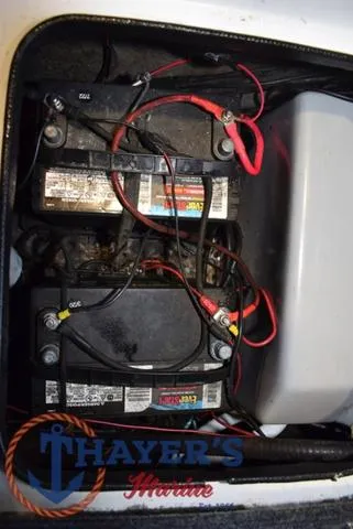 Slide: The Image of Battery compartment of a 1997 ProCraft 180 boat with visible wiring. - 22