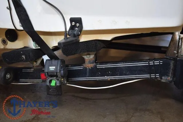 Slide: The Image of 1997 ProCraft 180 boat trailer hitch with wiring and Thayer's Marine logo. - 27