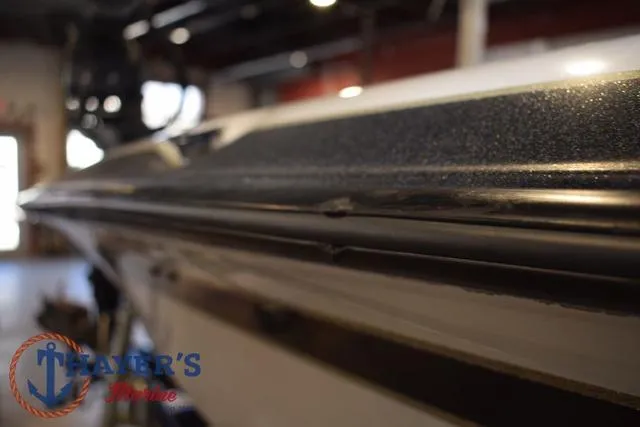 Slide: The Image of 1997 ProCraft 180 boat close-up, showcasing hull detail in indoor setting. - 30