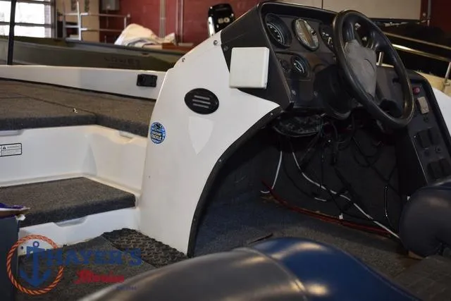 Slide: The Image of 1997 ProCraft 180 boat interior with steering wheel and dashboard controls. - 33