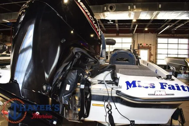 Slide: The Image of 1997 ProCraft 180 boat with Mercury engine in a marina workshop. - 6