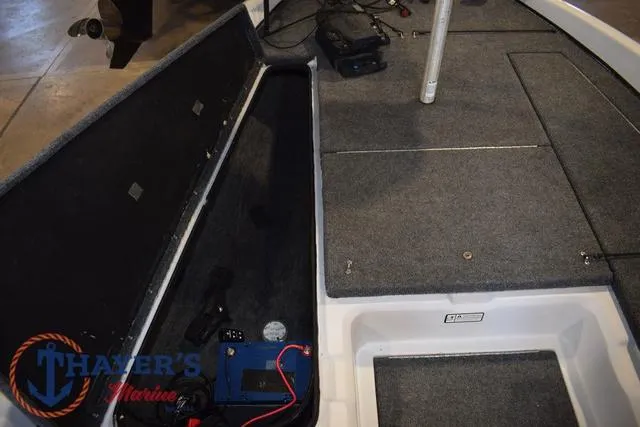 Slide: The Image of 1997 ProCraft 180 boat interior with storage compartments and marine equipment. - 8