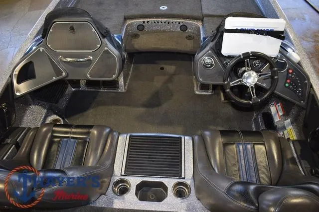 Slide: The Image of 2011 Ranger Z520C boat interior with steering wheel and seating. - 15