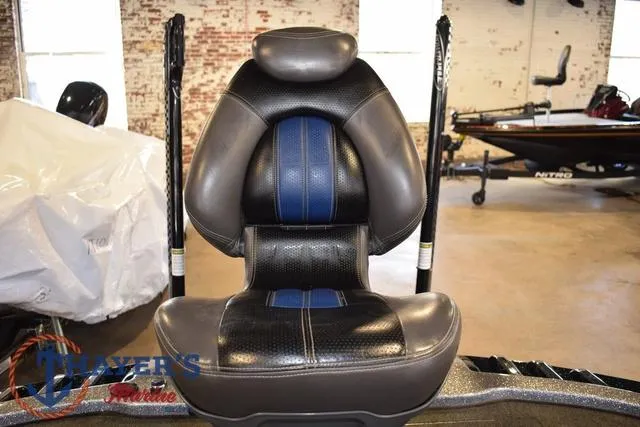 Slide: The Image of Ranger Z520C 2011 boat seat with black and blue upholstery in a showroom. - 16