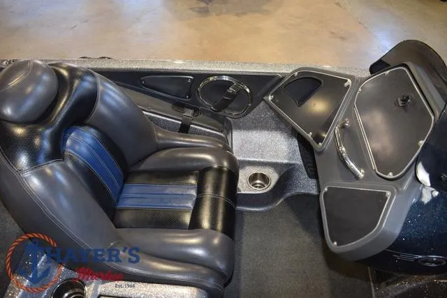 Slide: The Image of 2011 Ranger Z520C boat interior with black leather seats and dashboard. - 18