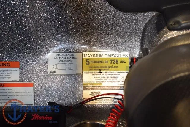 Slide: The Image of 2011 Ranger Z520C boat capacity label, seating for 5 or 725 lbs, Thayer's Marine logo. - 20