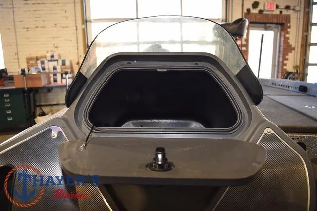 Slide: The Image of Open storage compartment of 2011 Ranger Z520C boat in a workshop setting. - 21