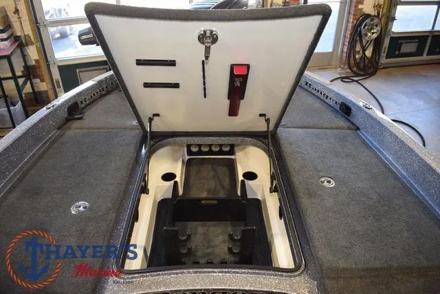 Slide: The Image of 2011 Ranger Z520C boat storage compartment open, showing interior layout and features. - 22