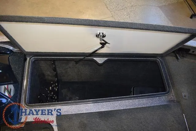 Slide: The Image of Open storage compartment in a 2011 Ranger Z520C boat. - 24