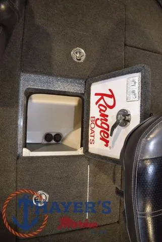 Slide: The Image of 2011 Ranger Z520C boat storage compartment with logo and secure latch. - 27