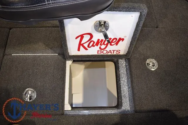 Slide: The Image of 2011 Ranger Z520C boat storage compartment with Ranger Boats logo. - 28