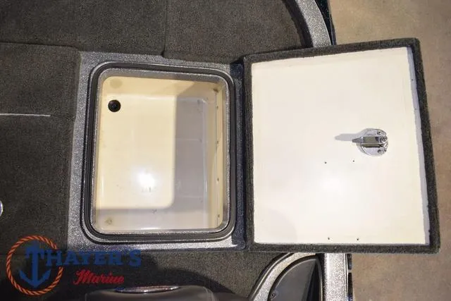Slide: The Image of Open storage compartment on a 2011 Ranger Z520C boat. - 29