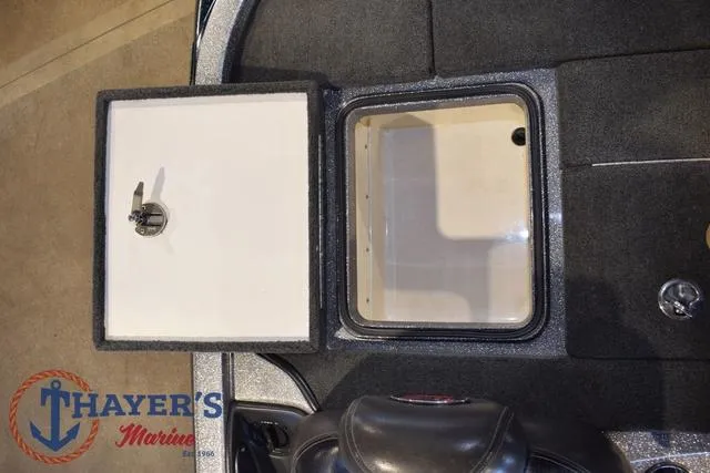 Slide: The Image of Open storage compartment on 2011 Ranger Z520C boat, featuring Thayer's Marine logo. - 30