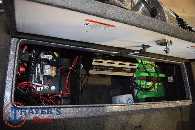 Slide: The Image of 2011 Ranger Z520C boat battery compartment with wiring and chargers. - 31