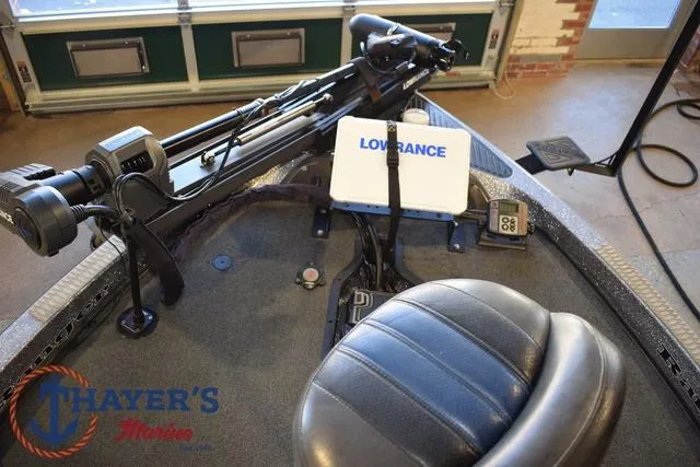 Slide: The Image of 2011 Ranger Z520C boat interior with Lowrance electronics and Thayer's Marine logo. - 33