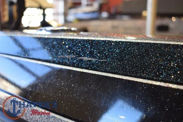 Slide: The Image of 2011 Ranger Z520C boat with sparkling black finish at Thayer's Marine showroom. - 39