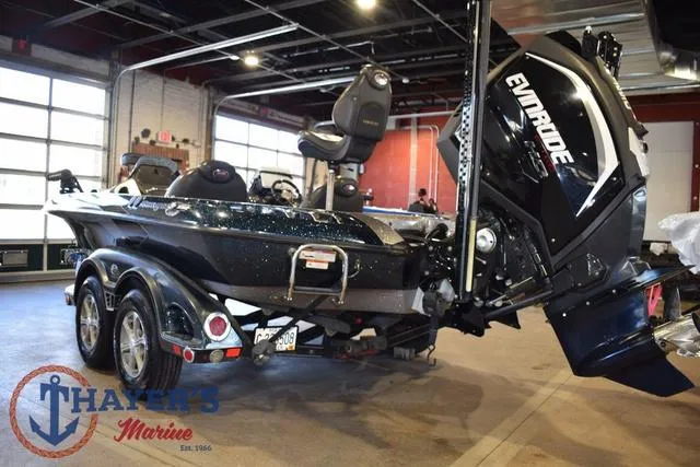 Slide: The Image of 2011 Ranger Z520C boat with Evinrude motor in a showroom. - 4