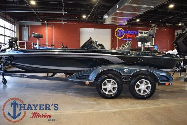 Slide: The Image of 2011 Ranger Z520C boat displayed at Thayer's Marine showroom. - 5