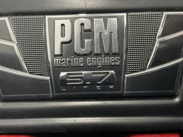 Slide: The Image of PCM marine engines 5.7 liter badge on 2015 Nautique 200 boat. - 15