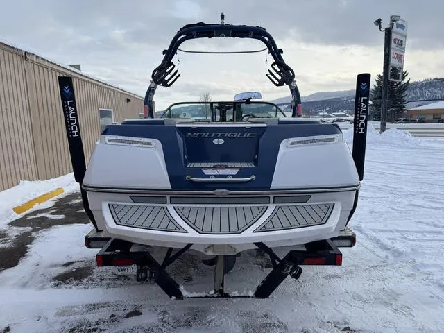 Slide: The Image of 2015 Nautique 200 boat on snowy ground, rear view with wakeboard tower. - 4