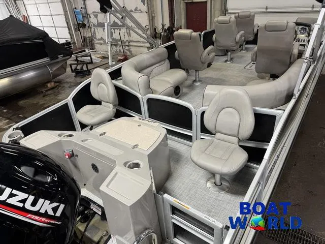 Slide: The Image of 2019 Premier Alante 240 DL pontoon boat interior with seating and Suzuki motor. - 14