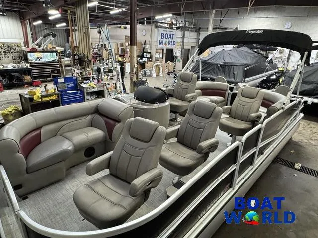 Slide: The Image of 2019 Premier Alante 240 DL pontoon boat with spacious seating in a workshop setting. - 16