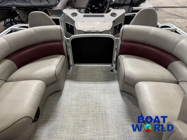 Slide: The Image of 2019 Premier Alante 240 DL pontoon boat interior with plush seating and console. - 21