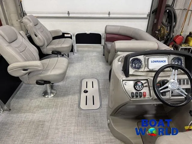 Slide: The Image of 2019 Premier Alante 240 DL boat interior with plush seating and modern dashboard. - 23