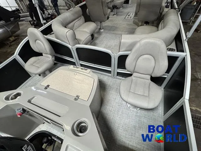 Slide: The Image of 2019 Premier Alante 240 DL pontoon boat interior with gray seating and console. - 25