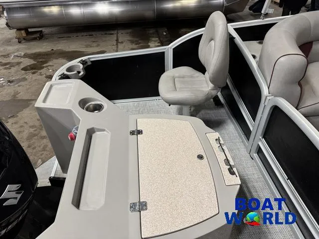 Slide: The Image of 2019 Premier Alante 240 DL pontoon boat interior with seating and storage. - 27