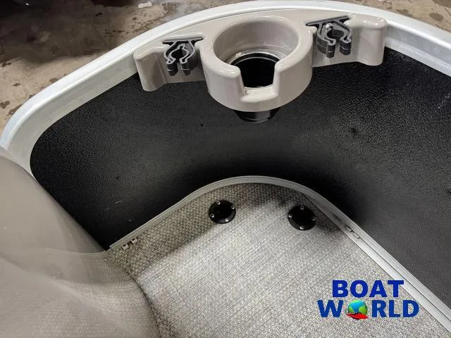Slide: The Image of 2019 Premier Alante 240 DL boat interior with cup holder and Boat World logo. - 29