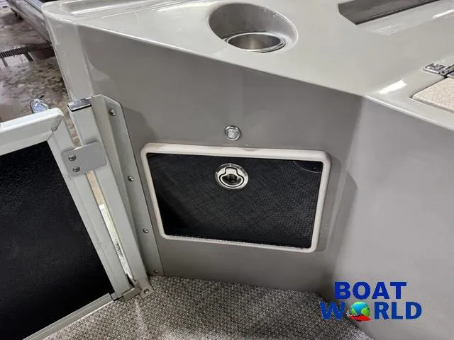 Slide: The Image of 2019 Premier Alante 240 DL boat interior with storage compartment and cup holder. - 34