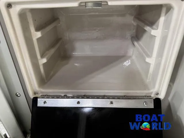 Slide: The Image of Open storage compartment in a 2019 Premier Alante 240 DL boat. - 35