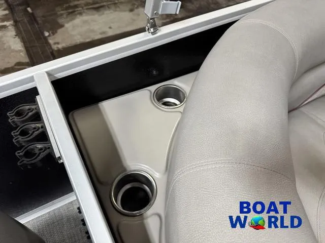 Slide: The Image of 2019 Premier Alante 240 DL boat interior with cup holders and seating, branded "Boat World." - 37