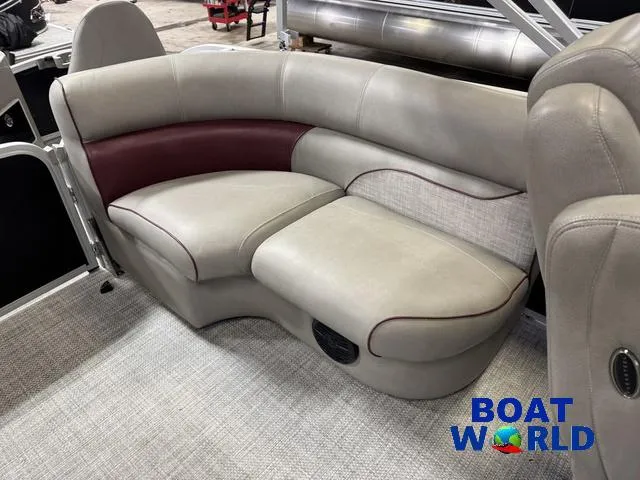 Slide: The Image of 2019 Premier Alante 240 DL pontoon boat interior seating with beige and maroon upholstery. - 40