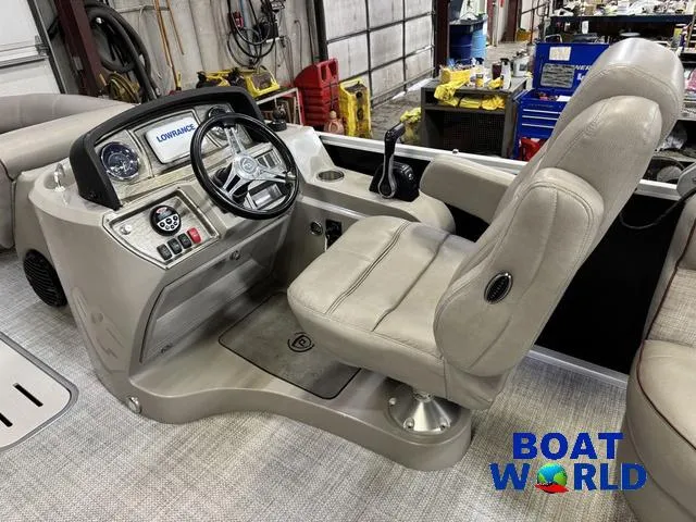 Slide: The Image of 2019 Premier Alante 240 DL boat interior with captain's chair and control panel. - 41
