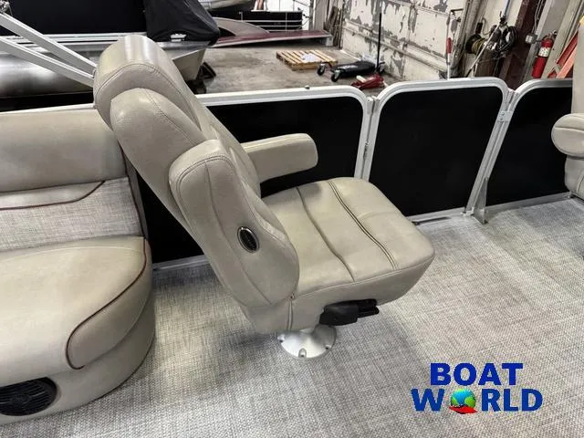 Slide: The Image of 2019 Premier Alante 240 DL boat interior with beige seating and "Boat World" logo. - 42