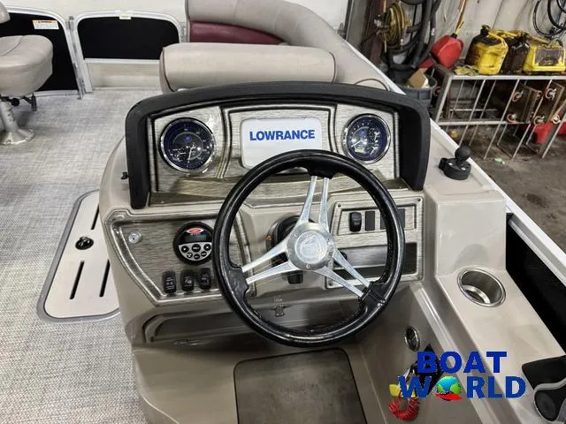 Slide: The Image of 2019 Premier Alante 240 DL boat dashboard with Lowrance system and steering wheel. - 47