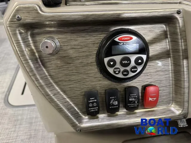 Slide: The Image of Control panel of 2019 Premier Alante 240 DL boat with switches and audio system. - 49