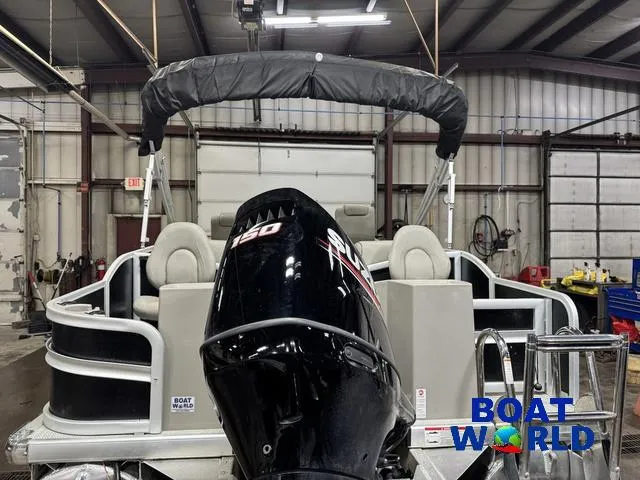 Slide: The Image of 2019 Premier Alante 240 DL pontoon boat with outboard motor in a warehouse setting. - 5
