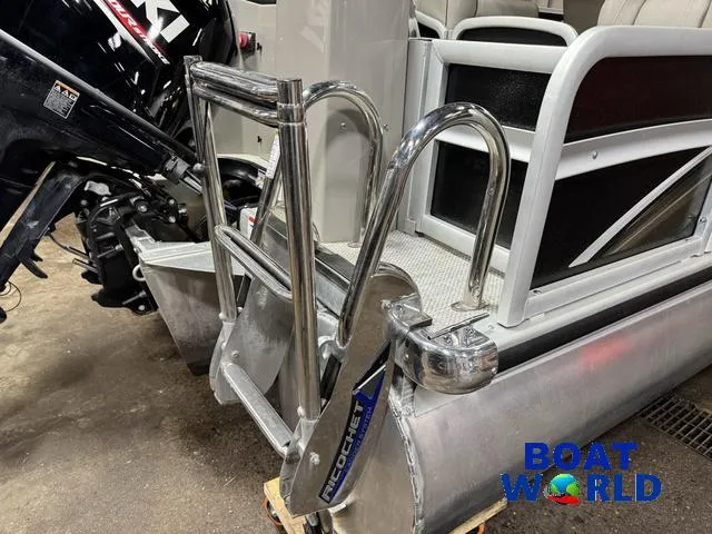 Slide: The Image of ```json
"Premier Alante 240 DL 2019 boat with ladder and motor, displayed at Boat World."
``` - 9