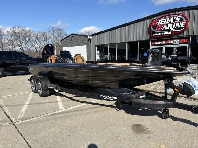 Slide: The Image of 2025 Caymas XS 21 Pro boat on trailer at Weda's Marine dealership. - 10