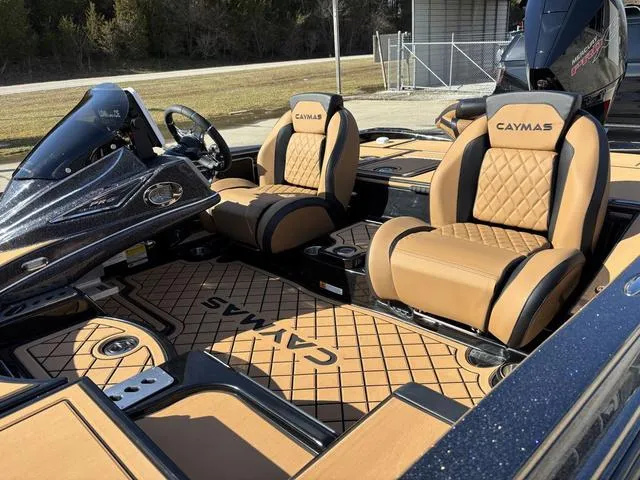 Slide: The Image of 2025 Caymas XS 21 Pro boat interior with tan leather seats and detailed flooring. - 14